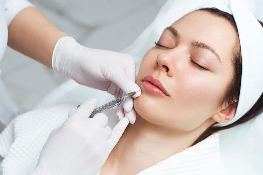 Lip enhancement and correction procedure in a cosmetic salon.