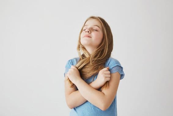 Pretty blonde girl takes a deep breath of fresh air.