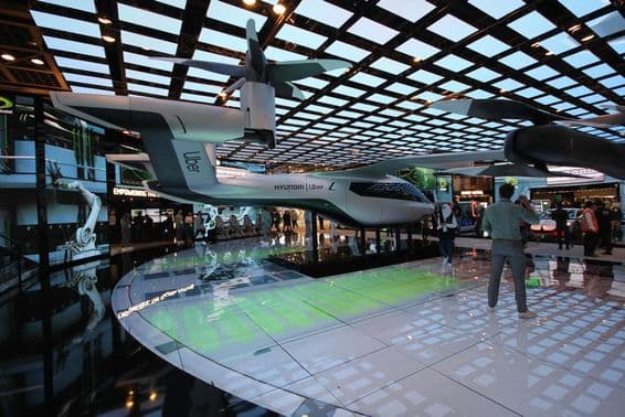 Full-size Hyundai Uber air taxi model displayed at the Etisalat pavilion.