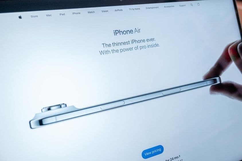 The iPhone Air landing page appearing on a MacBook screen on the Apple website.