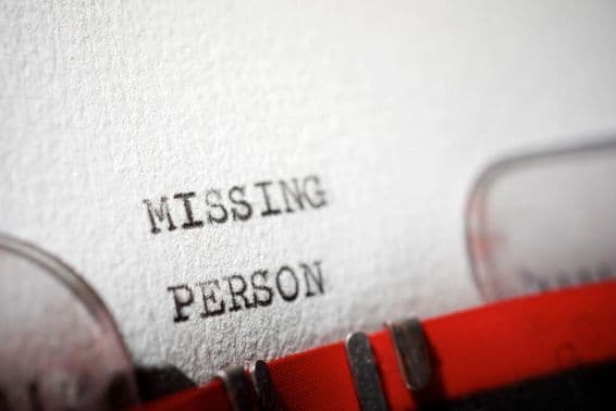 Text about a missing person typed on a typewriter.