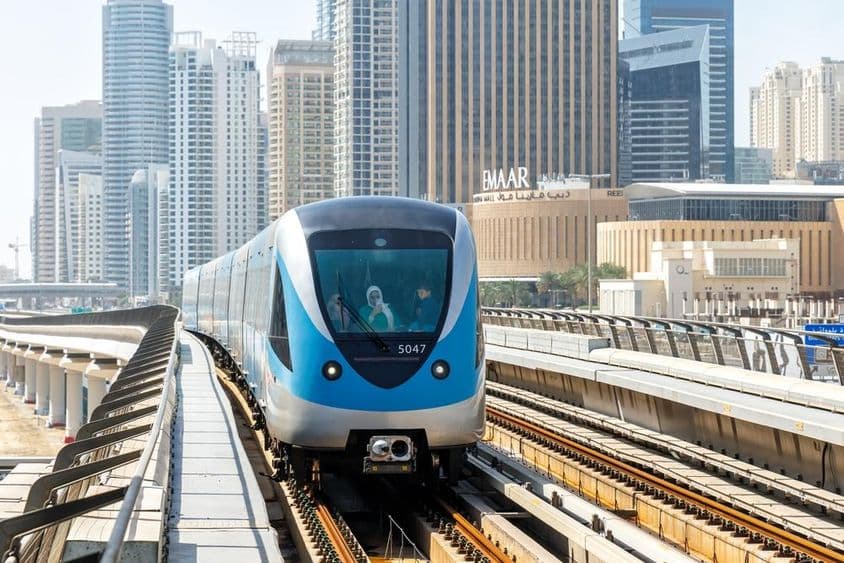 Dubai Metro train mass transit near Dubai Marina station.