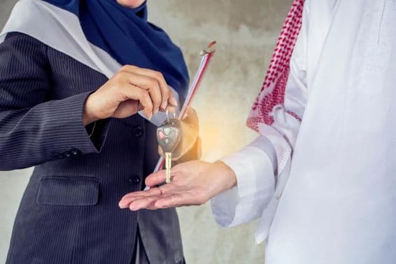 Handing over keys to a tenant.