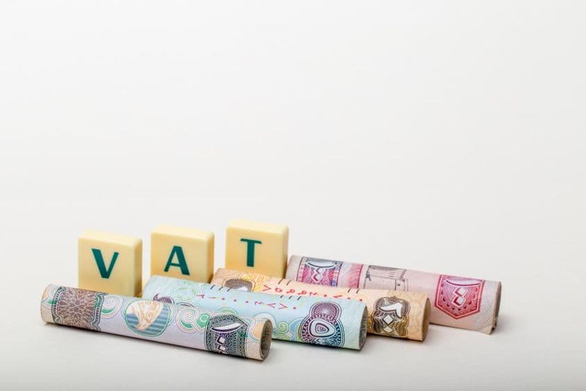 The letters VAT (Value Added Tax) above UAE dirham banknotes.