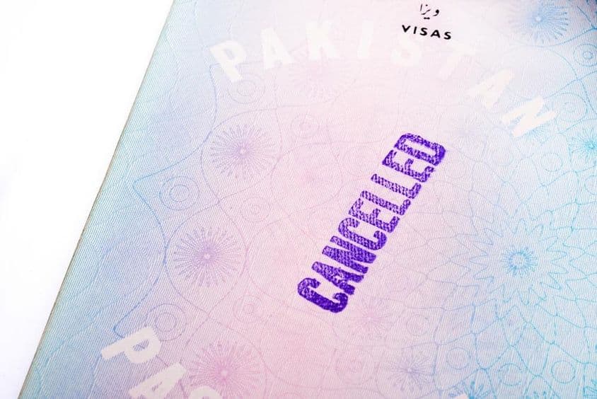 Visa-free stamp on an old Pakistani passport page.