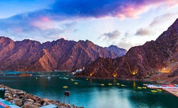 Beautiful view of the Hatta Dam or lake and the Hajar Mountains.