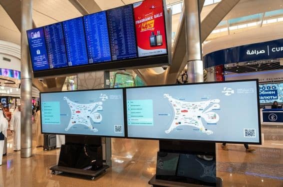 Flight information on Abu Dhabi Zayed International Airport terminal monitors.