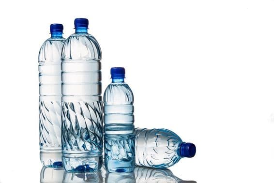 Four refreshing natural mineral water in plastic bottles.