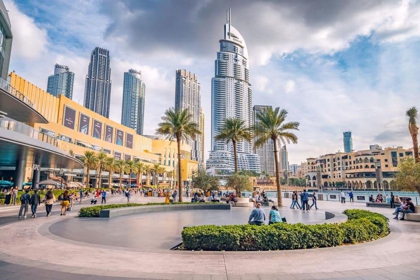 Crowd of tourists walking near the entrance of Dubai Mall.