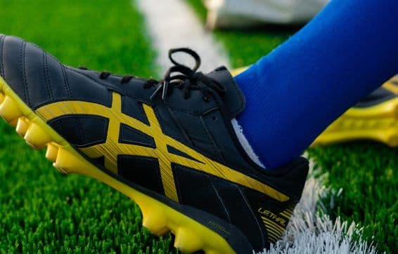 Dubai stadium and a football boot.