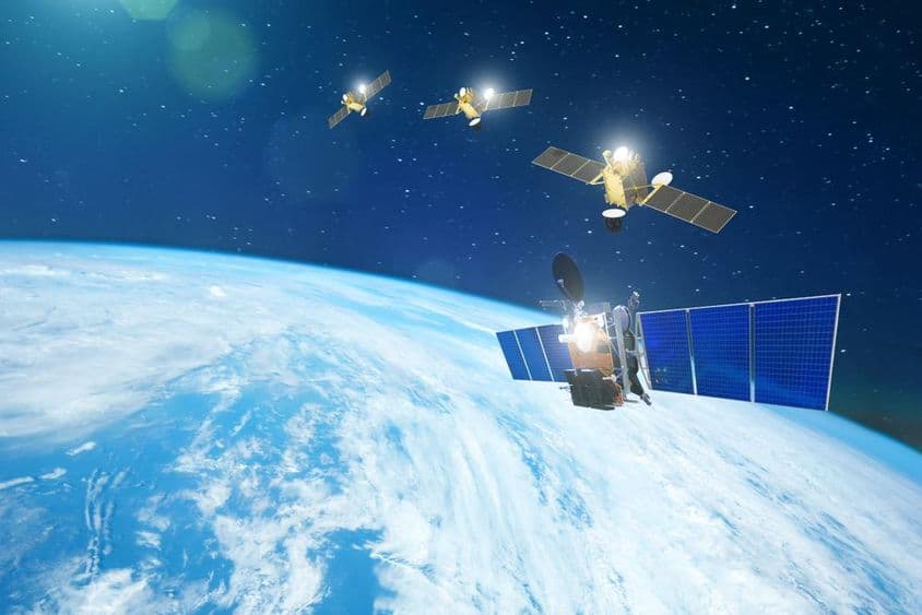 Set of satellites orbiting Earth in a line.