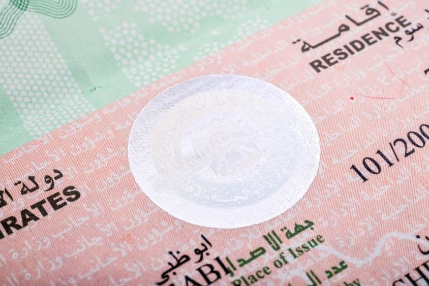 United Arab Emirates residency visa stamp in a passport.