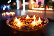 Diwali oil lamps in a bowl.