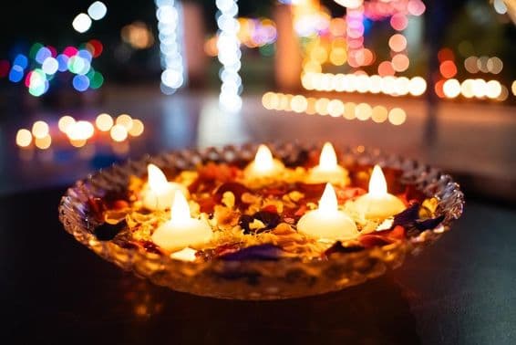 Diwali oil lamps in a bowl.