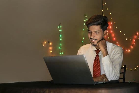 Young Indian man working during Diwali celebration in offices.