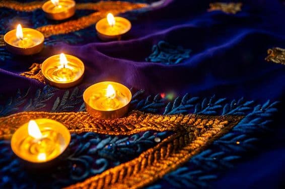 Diwali lighting on a blue sari with gold embroidery.