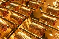 Gold bracelets in a jewelry shop at the Dubai Golden Souk market.