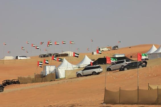 Off-road vehicles and wild camping on massive sand dunes.