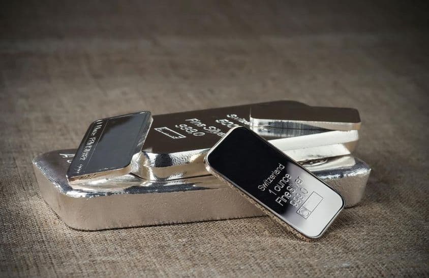Several investment silver bars of different weights.