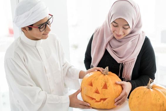 Arab child with a Halloween pumpkin.