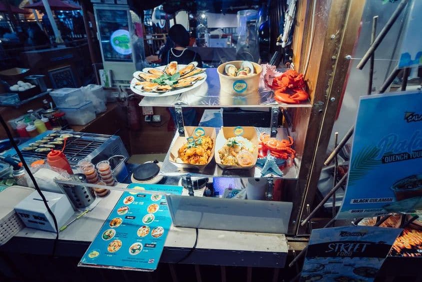 Traditional Thai cuisine on a floating restaurant with street foods at Global Village, Dubai.