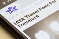 The introductory page of the IATA travel pass is visible.