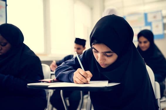 Muslim children learning in a classroom.