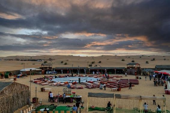 Sunset over a Bedouin camp following traditional desert safaris in Dubai.