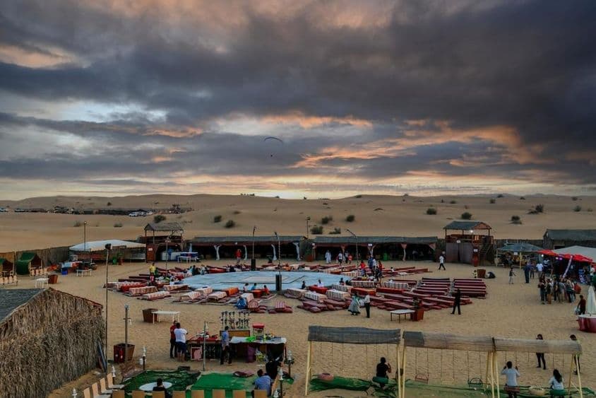 Sunset over a Bedouin camp following traditional desert safaris in Dubai.