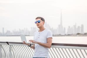 Happy male freelance programmer.