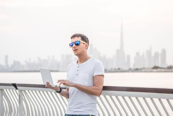 Happy male freelance programmer.