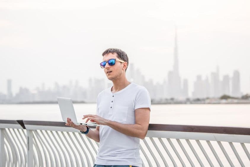 Happy male freelance programmer.