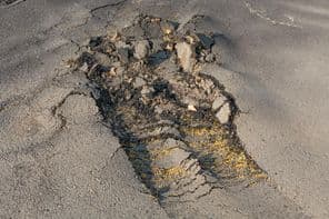 The street's asphalt surface was removed due to poor execution.