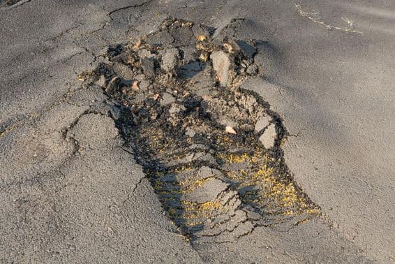 The street's asphalt surface was removed due to poor execution.