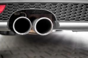 An automobile's silver exhaust pipe.