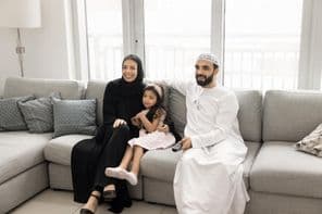 Happy loving Arab family with young parents.