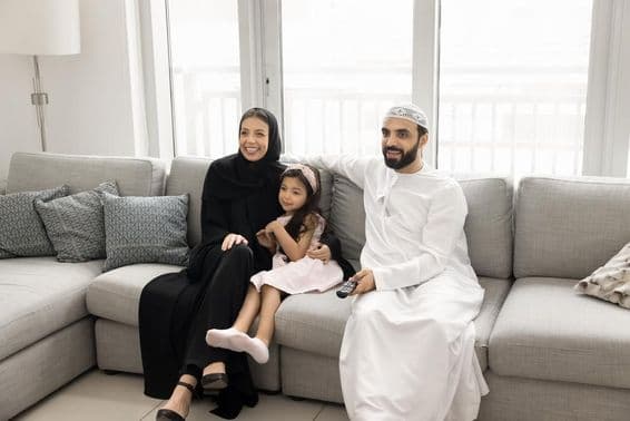 Happy loving Arab family with young parents.