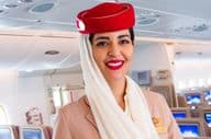 Smiling flight attendant, Emirates airline.