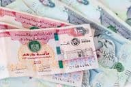 UAE dirhams, banknotes, one and five hundred dirham bills.