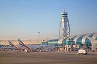 Airplanes preparing for takeoff at Dubai airport.