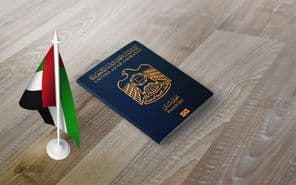 Passport of United Arab Emirates with national flag.
