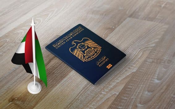 Passport of United Arab Emirates with national flag.