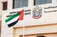 Coat of arms and flag of the UAE Ministry of Finance in Dubai.