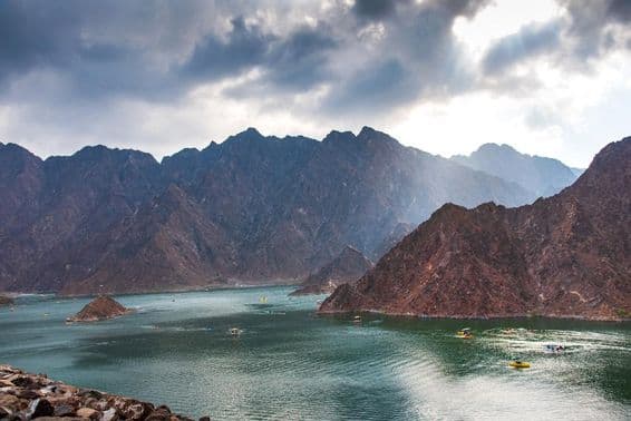 Hatta dam lake scenery in Dubai, UAE at sunset.