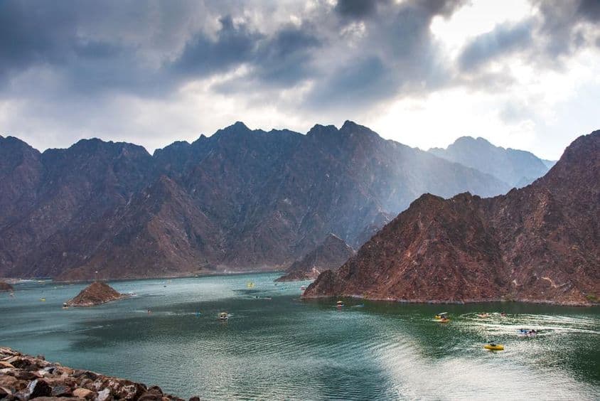 Hatta dam lake scenery in Dubai, UAE at sunset.