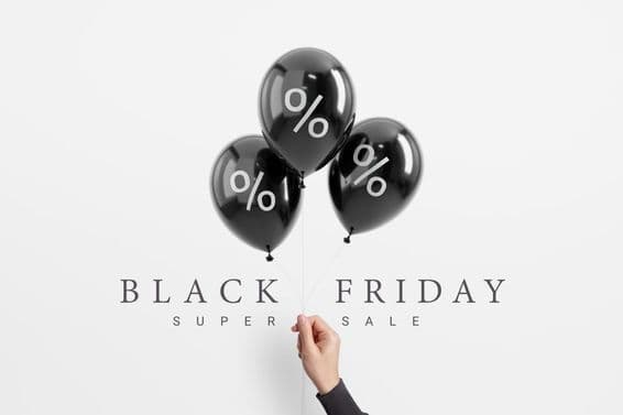 Black Friday sale percentage on black shiny balloon.