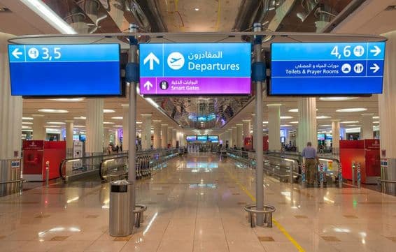 Sign for Departures at Dubai International Airport.