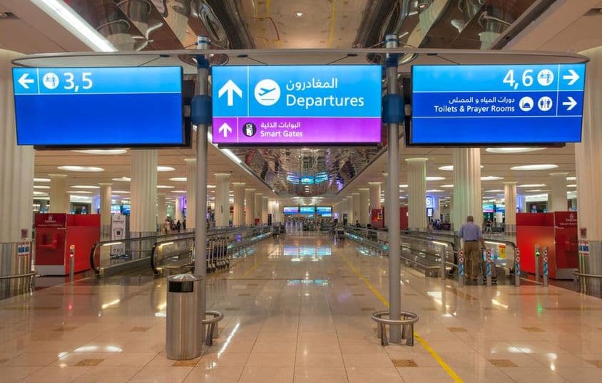 Sign for Departures at Dubai International Airport.