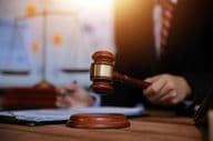 Judge's gavel in a courtroom.