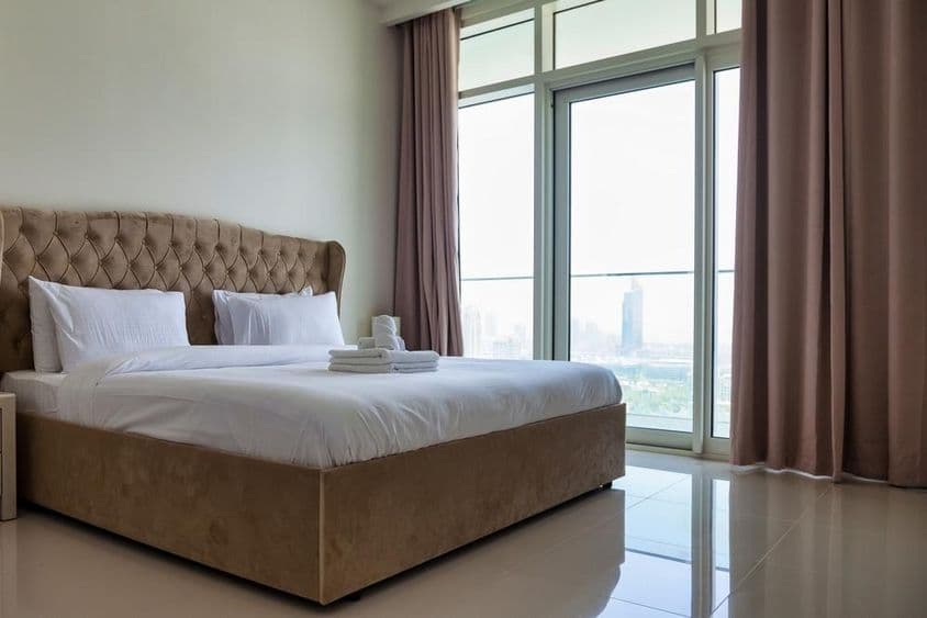 A spacious bedroom in a modern apartment.